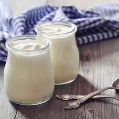 Glasses of yogurt with spoons