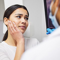 Patient viewing her X-rays in the dentist’s office